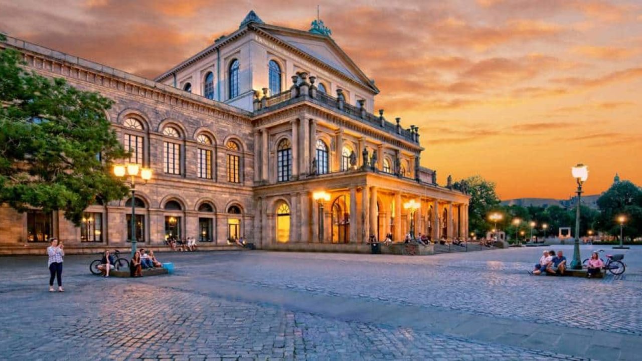 Hanover Opera House at sunset, illuminated historical cultural site in the city centre.